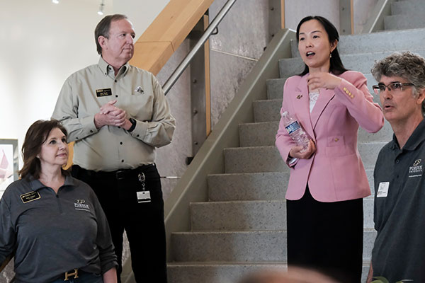 Staff working alongside researchers in a Purdue research facility.